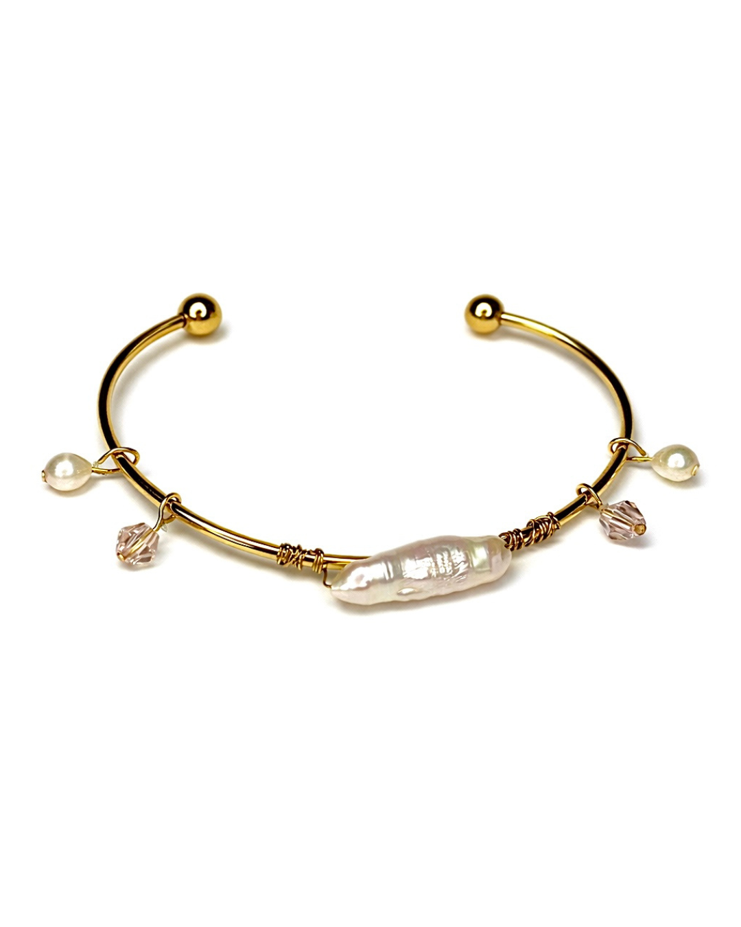 Gold bracelet with pearls and crystals on a white background