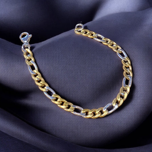 A bracelet with alternating gold and silver stainless steel links, displayed on a dark fabric background.