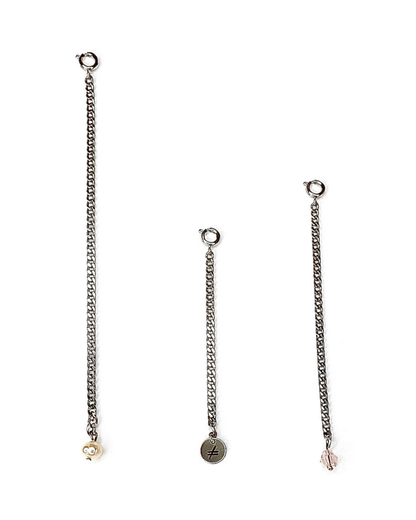 Three silver chain earrings with various pendants on a white background