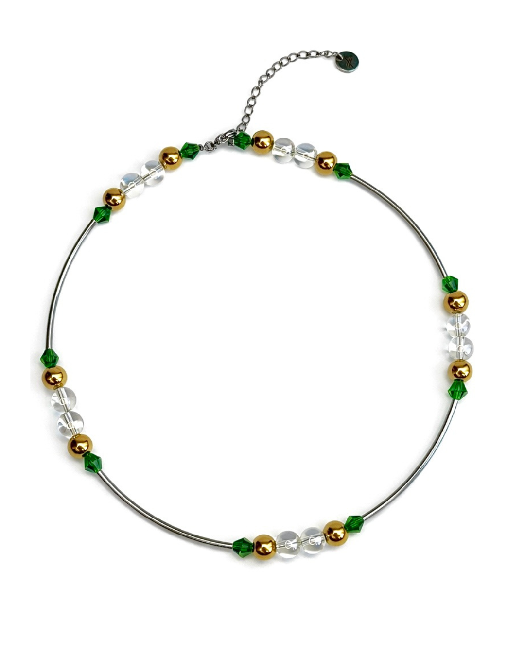 Necklace with green, gold, and clear beads on a white background