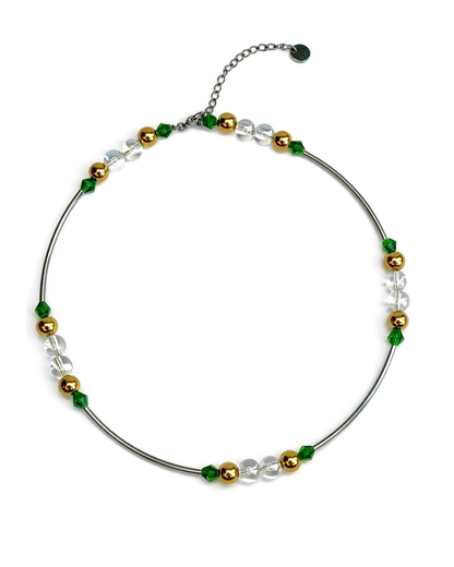 Necklace with green, gold, and clear beads on a white background