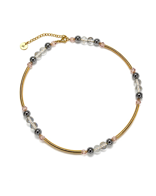 Gold bracelet with beads on a white background