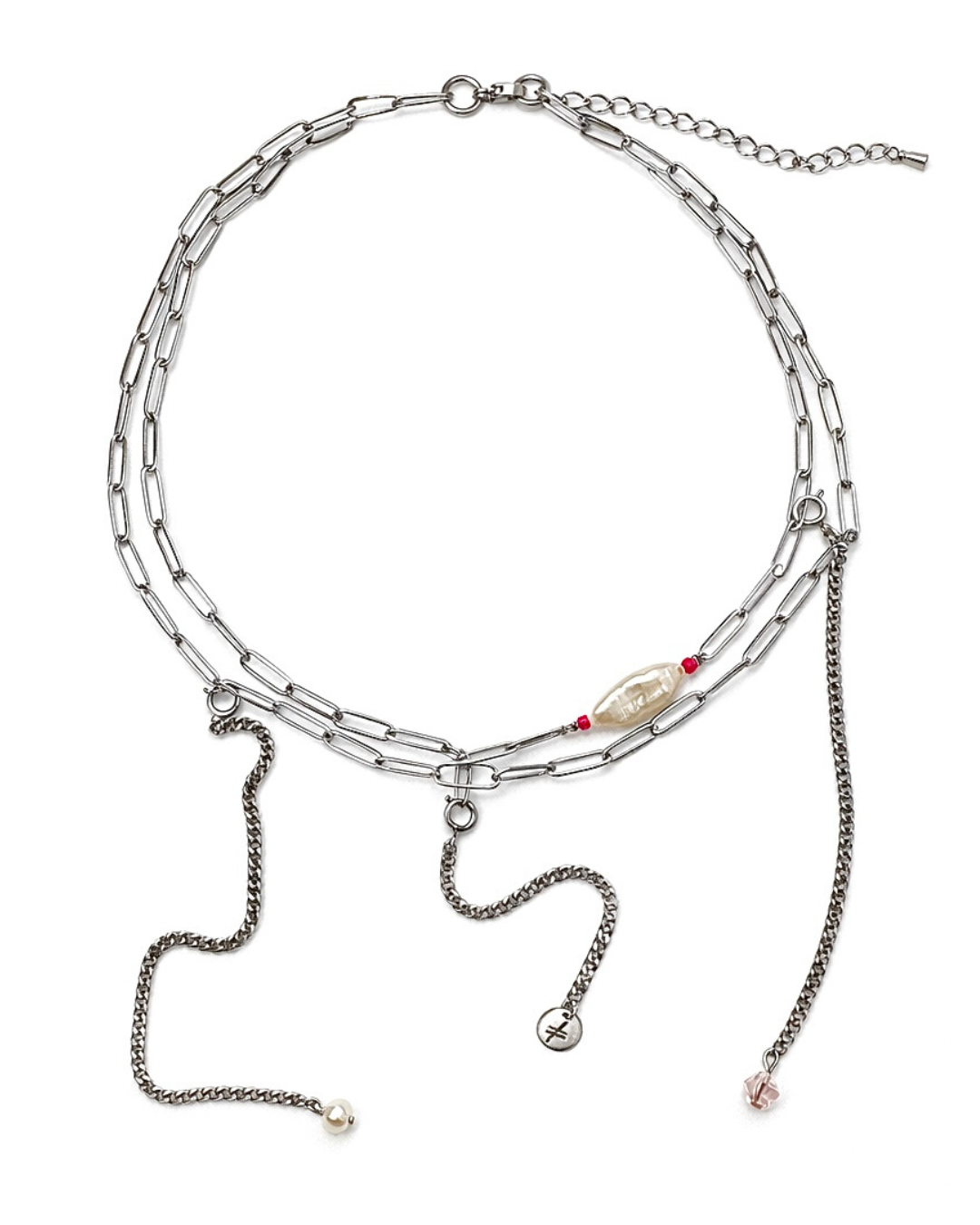 Multi-layered silver necklace with charms on a white background