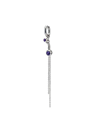 Silver charm with purple gemstones on a white background