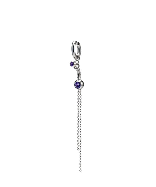 Silver charm with purple gemstones on a white background