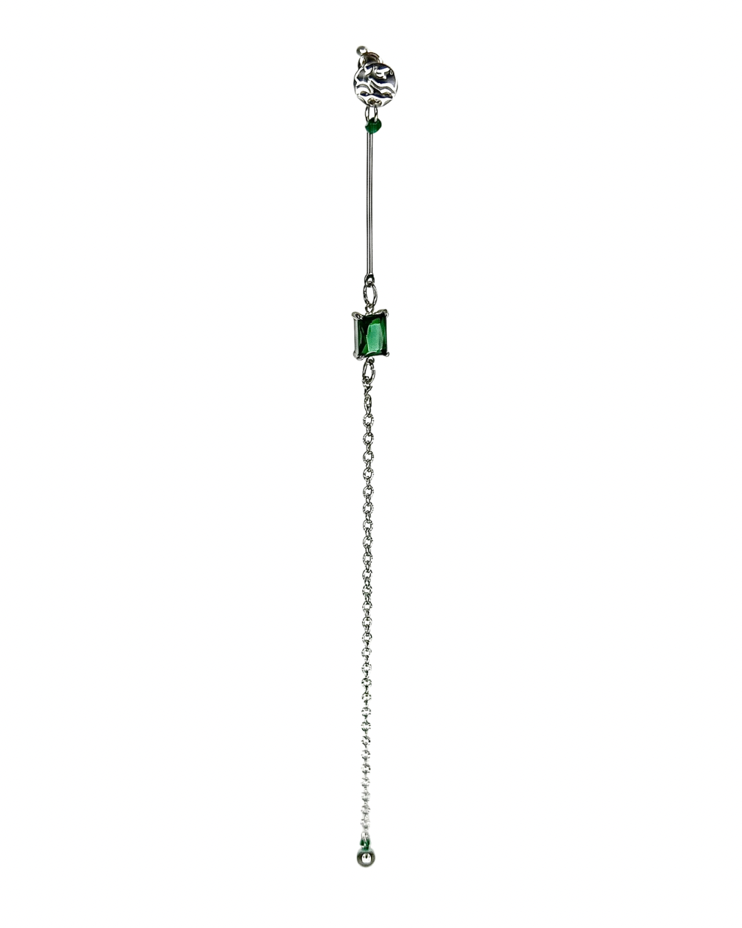 Jewelry with a chain and green gemstones on a white background