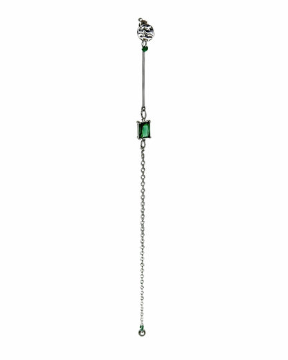 Jewelry with a chain and green gemstones on a white background